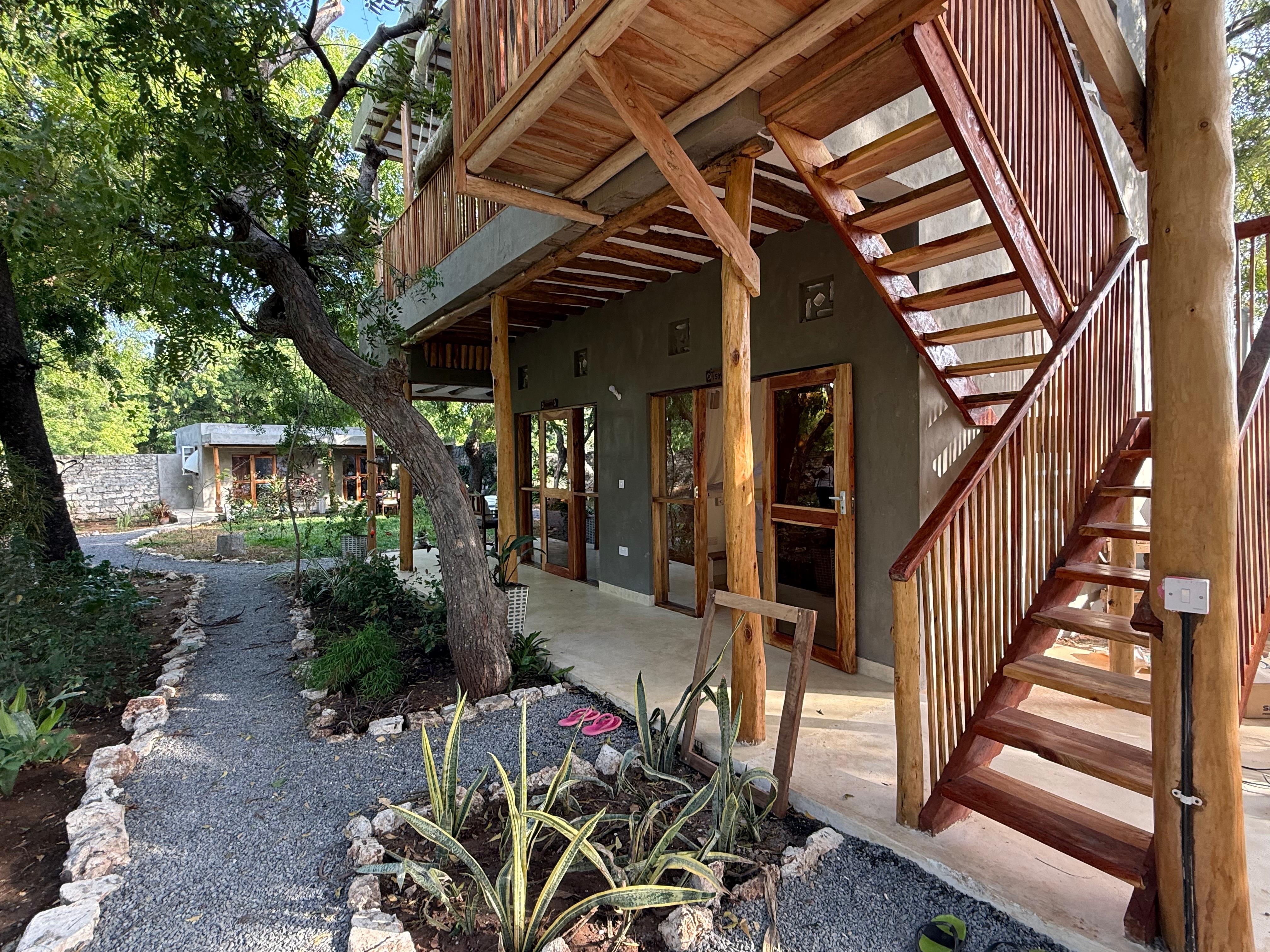 Coral-stone stairs to the treehouse