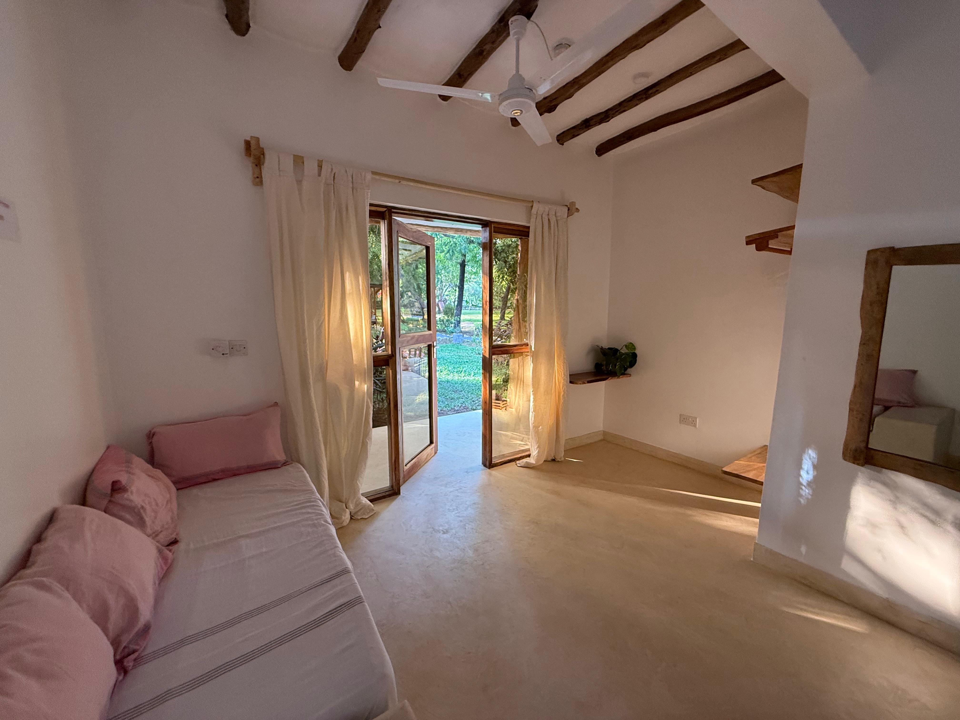 A bedroom holds the late golden light